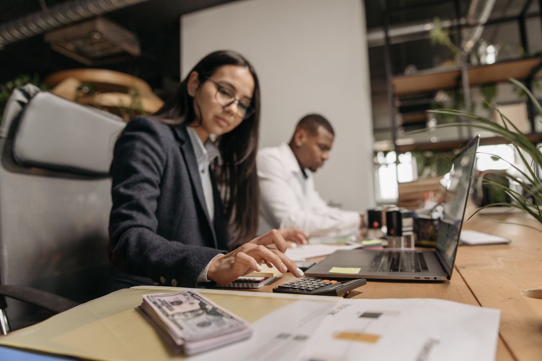 Two T&H accountants reviewing a client's figures together